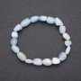 Bracelet made of natural aquamarine on elastic cord with guilloche, bead diameter 7x10(±)mm, circumference 18 cm