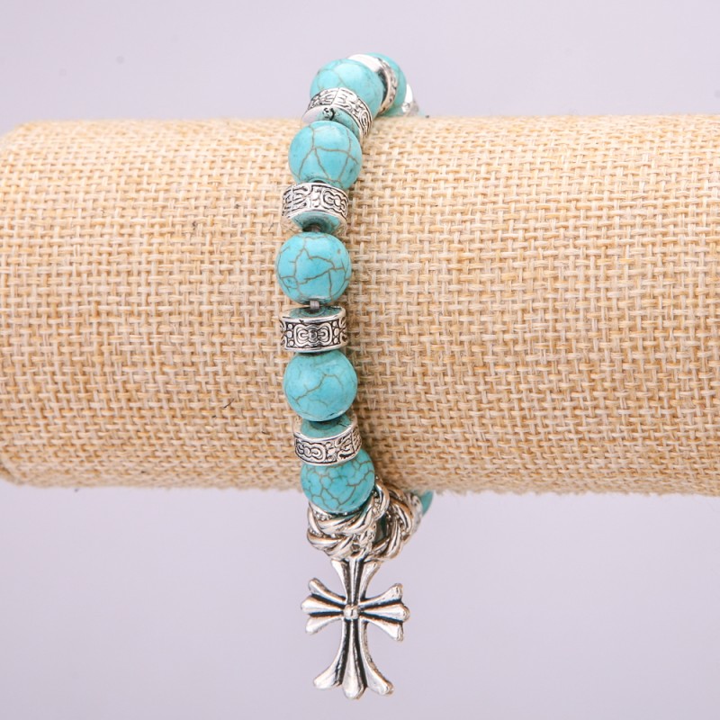 Turquoise bracelet on elastic cord, diameter 10(±)mm, length 18 cm with inlays and a cross pendant