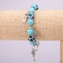 Turquoise amulet bracelet with blue 'Little Eyes' on elastic, diameter 10(+-)mm, length 18 cm with inlays and pendants
