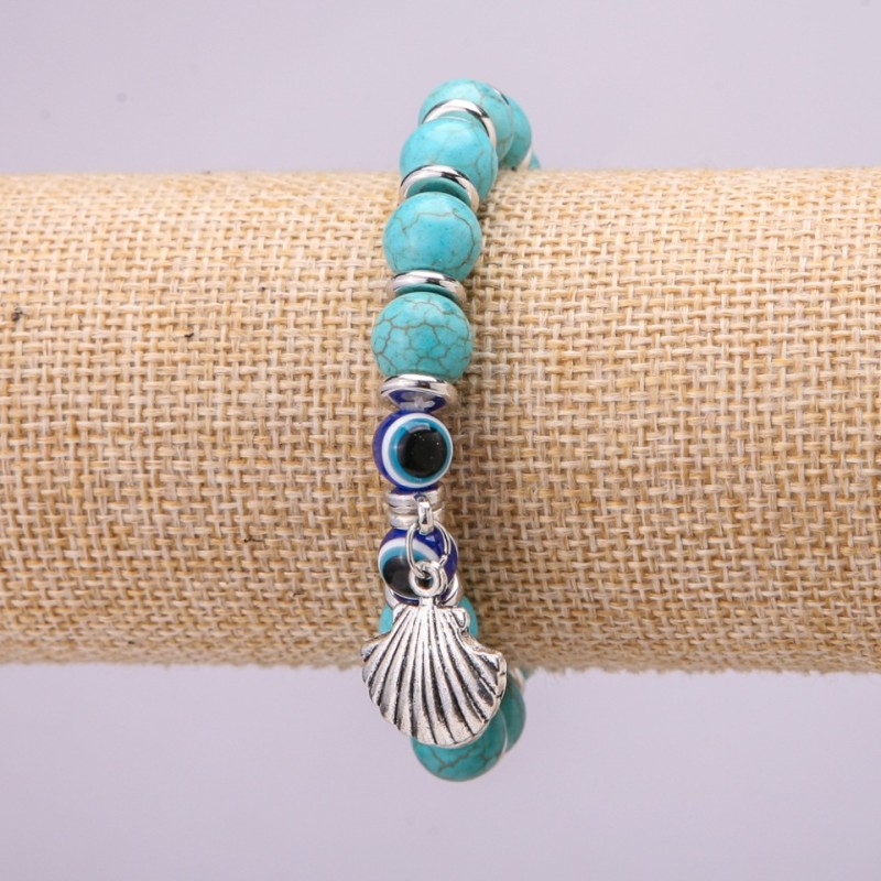 Bracelet-amulet Turquoise with blue 'eyes' on an elastic band, diameter 10 mm (±), length 18 cm with inlays and a pendant