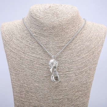 Pendant 'Bird with a Globe' 47x18 mm on a chain, length 70 cm, silver metal