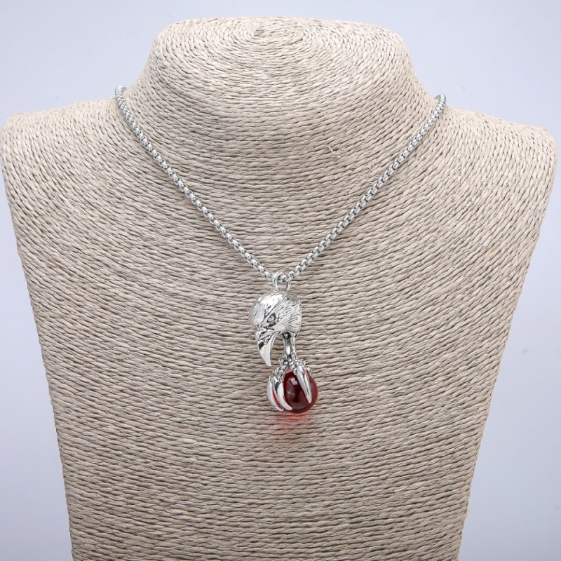 Pendant 'Bird with the Sphere' 47×18 mm on a chain, length 70 cm, silver-toned metal
