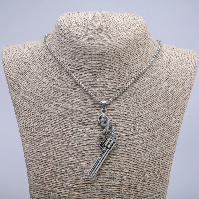 Pendant 'Revolver' 65x25 mm on a chain, length 70 cm, silver-toned metal