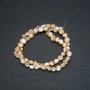 Beads on a thread, natural beige mother-of-pearl. Round faceted, diameter 7x5 mm, length 39 +