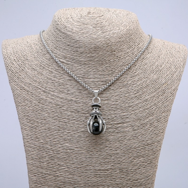 Pendant 'Paw with Sphere' 40x20 mm on a chain, length 70 cm, silver-colored metal