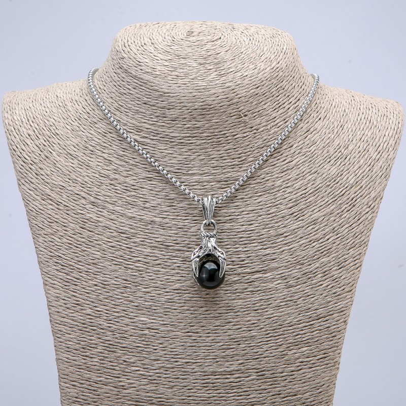 Pendant 'Paw with Sphere' 45x15 mm + - on a chain, length 70 cm + - silver metal