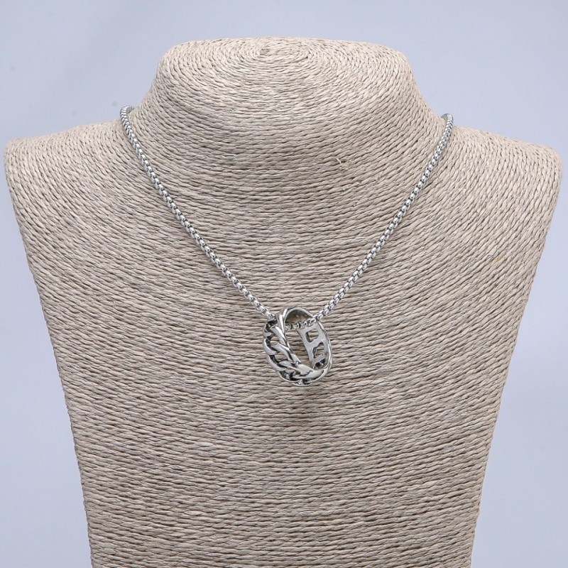 Pendant 'Ring' 26x10mm on a chain, length 70 cm +/-, silver-tone metal