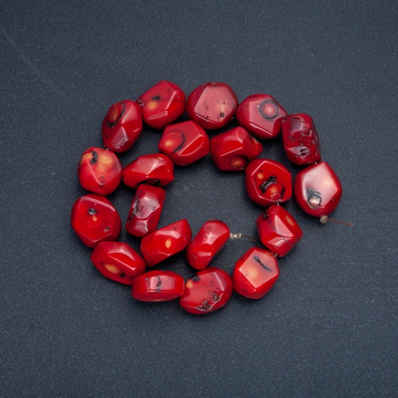 (Price per 100 g) Beads on a thread natural coral, faceted cut, diameter 18x14 mm +/-, length 41+