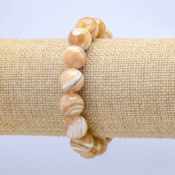 Elastic bracelet with natural beige mother-of-pearl. Smooth bead, 10 mm diameter, 18 cm length