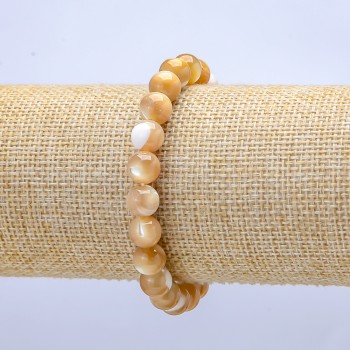 Elastic bracelet with natural beige Mother-of-Pearl. Smooth beads, 6 mm diameter, length 18 cm.