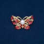 Discount! Butterfly brooch with gold-toned metal, red enamel, white rhinestones and a bead 46x30 mm +