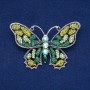 Butterfly Brooch in silvery metal, with green, lime, and gasoline crystals, 48×71 mm