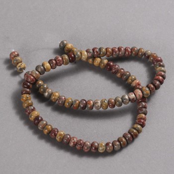 Beads on a strand of natural Mookaite Jasper, diameter 6x4 mm, length 39 cm.
