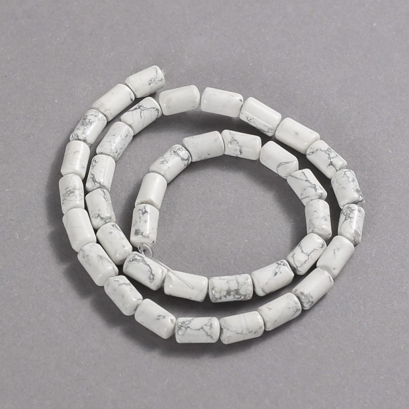 Beads on a string of natural howlite, smooth cylindrical, diameter 10x6 mm +/-, length 41 cm +