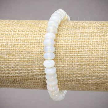 Stretch bracelet with synthetic Moonstone (synthetic) smooth rondels, diameter 8x5 mm ±, length 18 cm