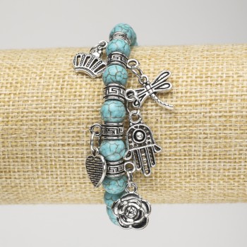 Turquoise Bracelet (named ) on elastic, diameter 8mm± with silver inserts and pendants, length 18 cm+