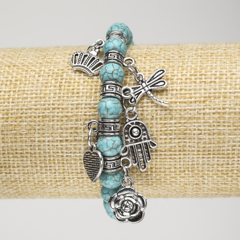 Turquoise Bracelet (named ) on elastic, diameter 8mm± with silver inserts and pendants, length 18 cm+