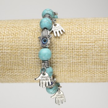 Turquoise bracelet on elastic, diameter around 10 mm ±, with silver palm-shaped inserts and pendants, length 18 cm