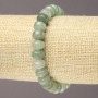 Elastic bracelet of natural jade with smooth rondels, diameter 9×7 mm