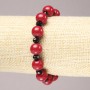 Elastic bracelet Coral (name) smooth bead, diameter 10 mm ± with faceted black glass disc 6×4 mm+