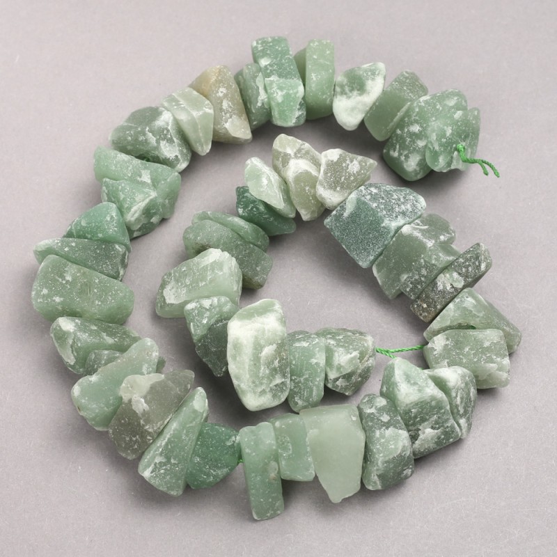 Beads of untreated jade on a thread, faceted, 10x20 mm, length 42 cm
