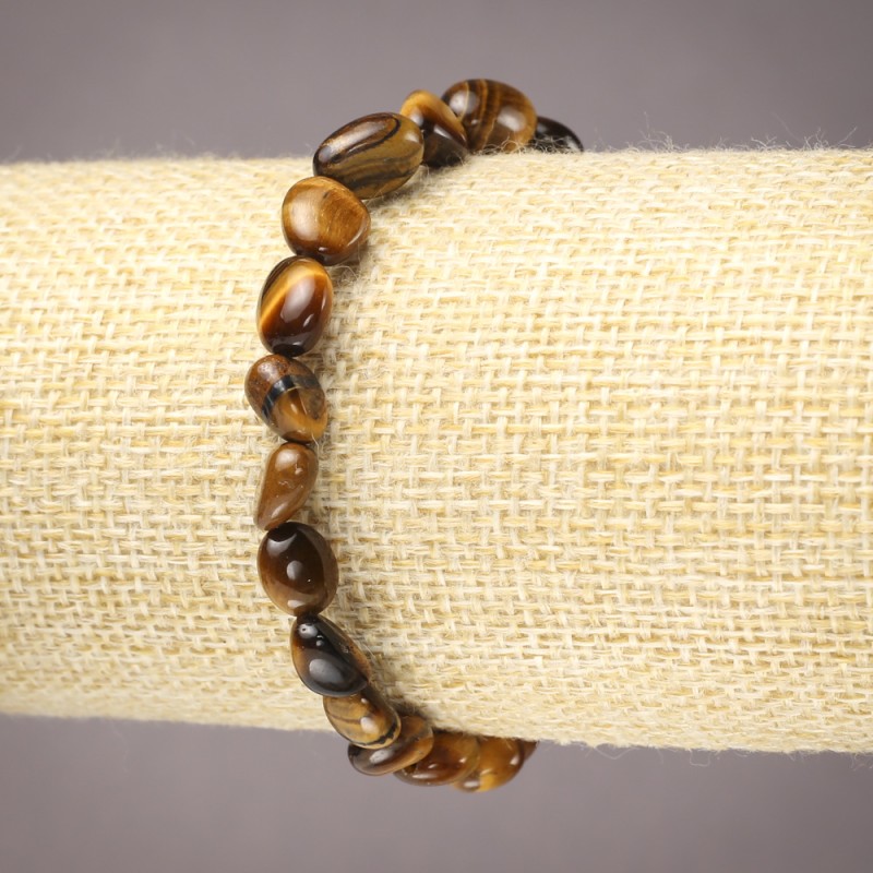 Elastic bracelet with natural Tiger's Eye, faceted, 6x8 mm diameter