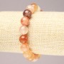 Elastic bracelet made of natural orange agate. Smooth bead, diameter 10.5 mm+