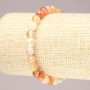 Elastic bracelet with natural orange agate, smooth bead, diameter 6.5 mm+