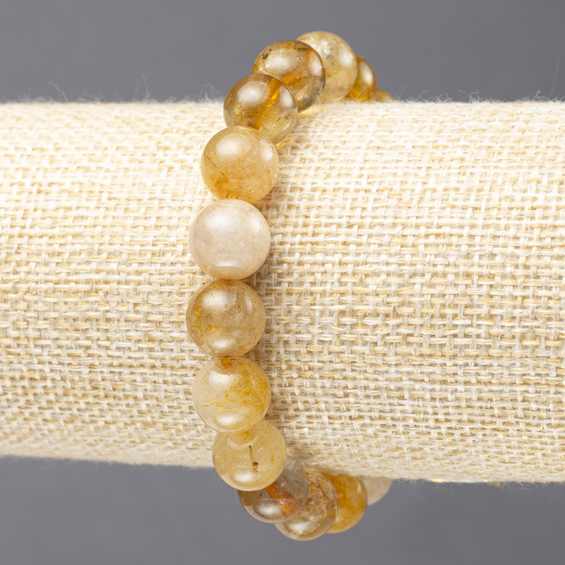 Elastic bracelet of natural Rutile Quartz with smooth beads, diameter 10± mm