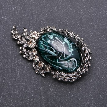 Discount! Brooch with gray rhinestones and emerald cabochon 64x38mm gray metal
