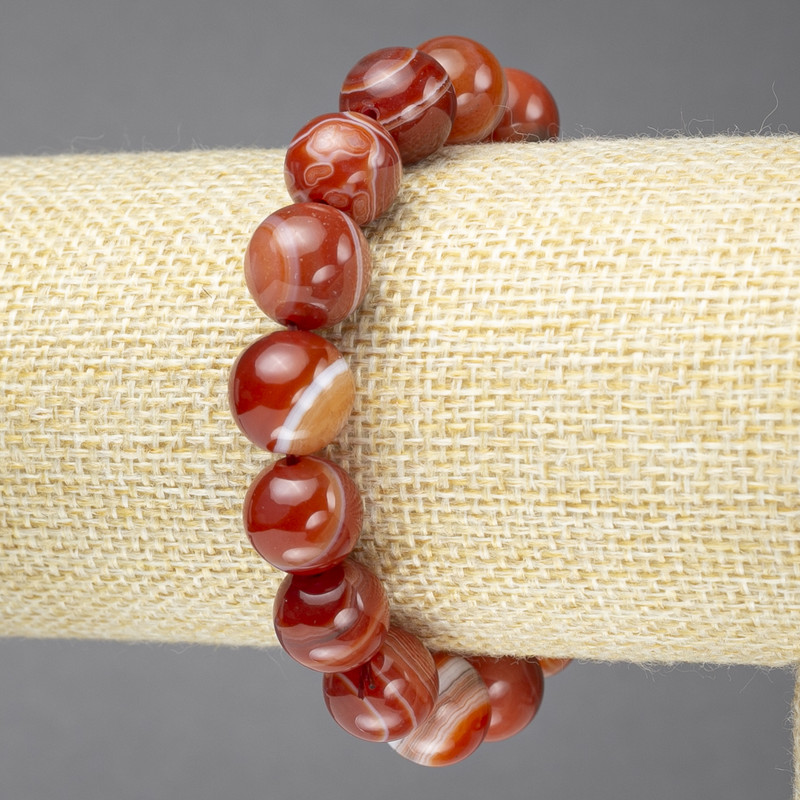 Elastic bracelet with natural orange eye agate, smooth bead, 12 mm diameter+