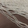 Beads Czech Crystal on beading thread white transparent with gasoline-toned faceted rondel, diameter 3×2.5 mm, length 36-38 cm