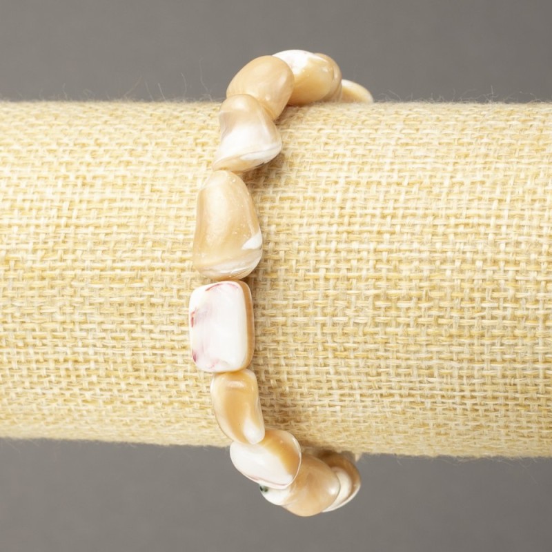 Elastic bracelet with natural beige mother-of-pearl, faceted bead, diameter 17x9 mm+