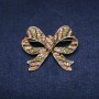 Brooch 'Accent Bow' 55x45mm with crystals, green and yellow, gold-tone metal