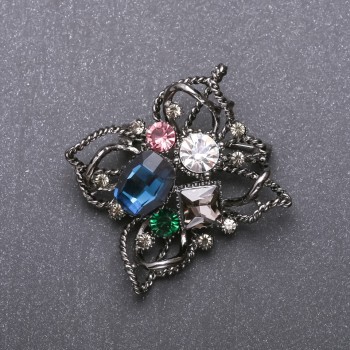 Brooch 'Order of Beauty' with blue crystal 51x48 mm black metal