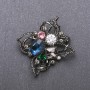 Brooch 'Order of Beauty' with blue crystal 51x48 mm black metal