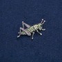 Brooch "Grasshopper" in silver-toned metal with black, green, and petrol rhinestones, 44x27mm +