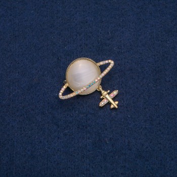 Saturn Cat's Eye Brooch (costume jewelry) with airplane motif, gold-tone metal, gasoline-colored rhinestones, 35x20 mm +