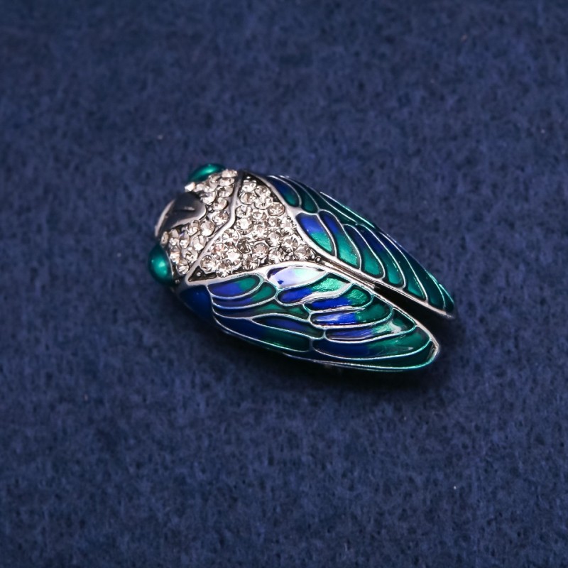 Cicada brooch with enamel and crystals in silver-tone metal, 19×35 mm
