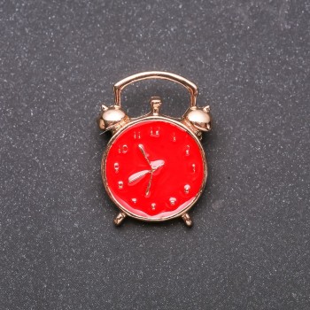 Brooch 'Alarm Clock' red enamel and yellow metal 20×27mm