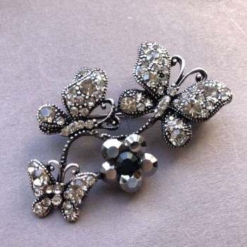 Bright Metal Brooch with Silver-Plated Finish, Butterflies Perched on a Flower Garland, Dark and White Rhinestones 55x34 mm +