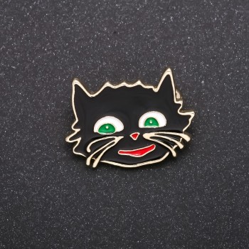 Brooch 'Cheshire Cat' with black enamel and yellow-tone metal, 27×22 mm