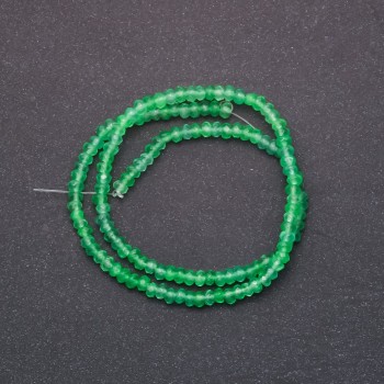 Beads of tinted stone imitating Chrysolite, faceted rondelles, diameter 4x2 mm, on a 38 cm strand