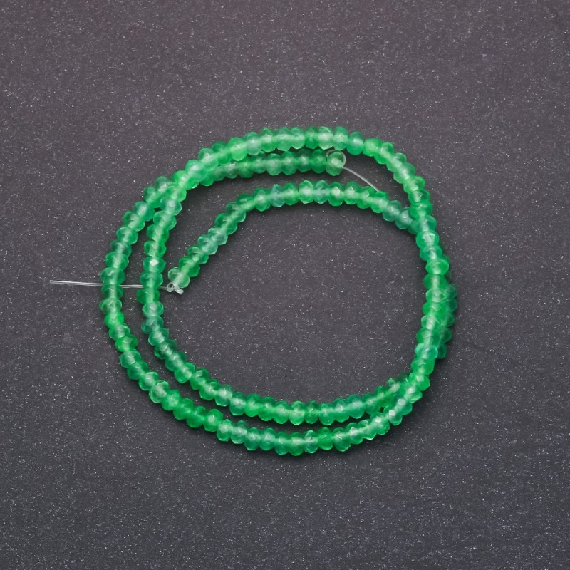Beads of tinted stone imitating Chrysolite, faceted rondelles, diameter 4x2 mm, on a 38 cm strand