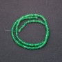 Beads of tinted stone imitating Chrysolite, faceted rondelles, diameter 4x2 mm, on a 38 cm strand