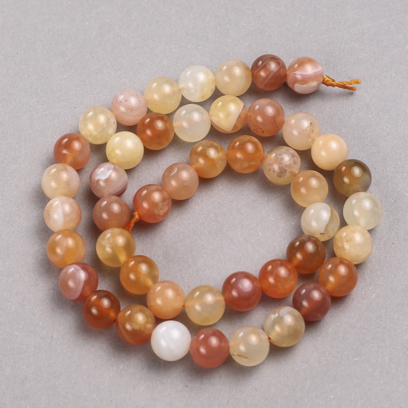 Orange agate beads on a thread. Smooth bead, diameter 8.5 mm, length 39 cm.