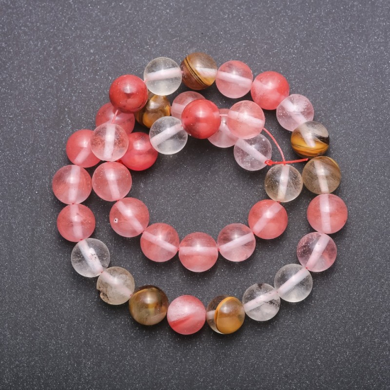 Assorted natural chalcedony beads on thread — smooth spheres, 10 mm diameter, 36 cm length