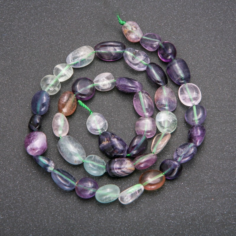 Beads on a strand of natural fluorite, diameter 7–9 mm, length 40 cm