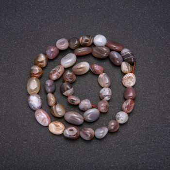 Beads on a thread of Botswana agate, faceted, diameter 10x8 mm, length 40 cm