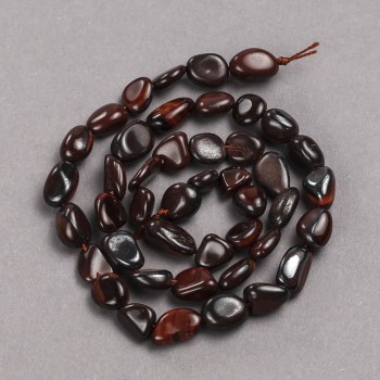 Beads on a thread of natural Bull's Eye stone, faceted, diameter 10×8 mm + -, length 39 cm +